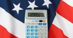calculator showing numbers on top of American flag