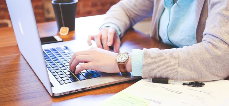A woman using a laptop on a table