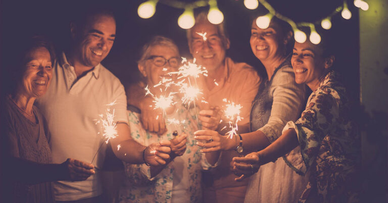 family and friends with sparklers celebrating