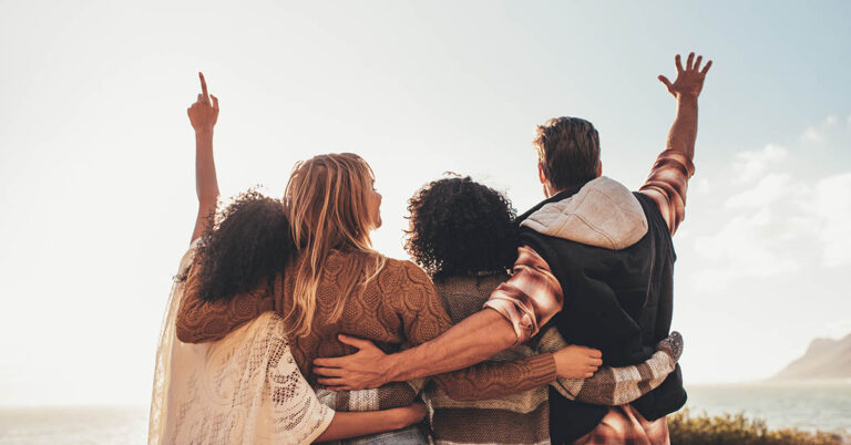 friends arm in arm supporting one another