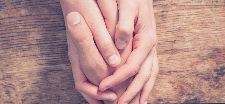 Two hands clasped