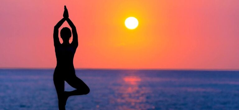 Silhouette of woman doing yoga