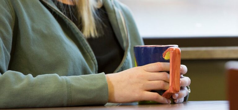 Woman holding mug