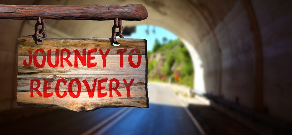 A sign that says "Journey to Recovery"