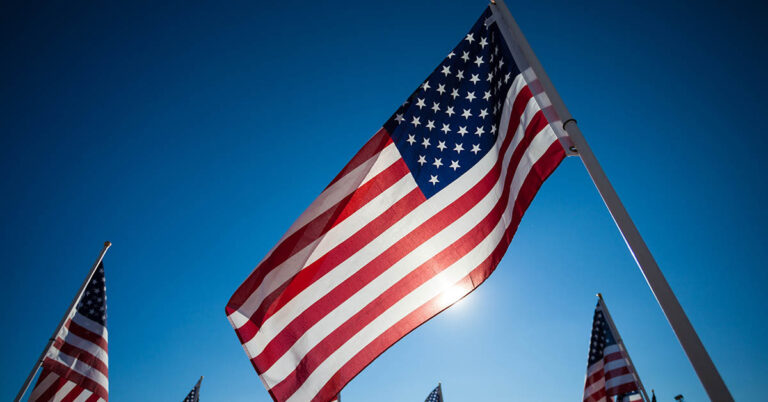 American flag against blue sky