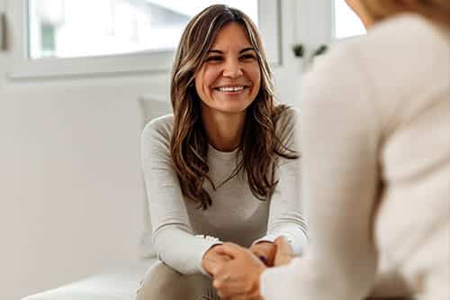 smiling woman with therapist v1