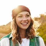 Photo of a happy smiling woman outside